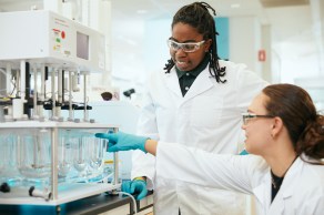 two scientists working together in a lab